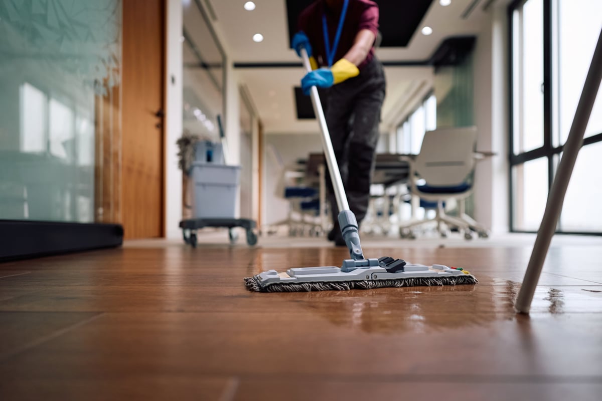 Close up of janitor mopping office floors